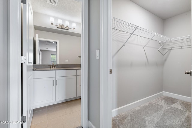 136 Longridge Ln, Ormond Beach, FL 32174 - walk in closet featuring a sink