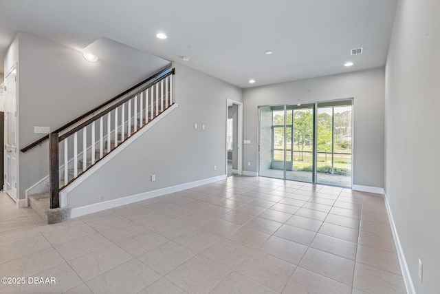 136 Longridge Ln, Ormond Beach, FL 32174 - unfurnished room with stairway, recessed lighting, baseboards, and light tile patterned floors