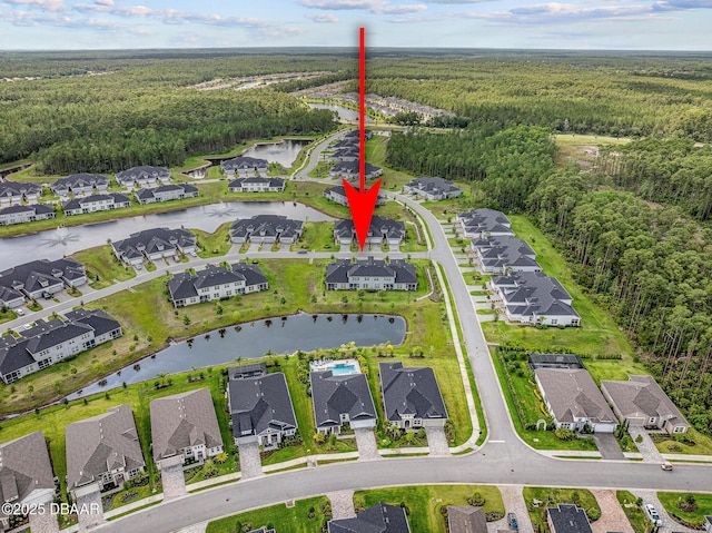 136 Longridge Ln, Ormond Beach, FL 32174 - aerial perspective of suburban area with a forest and a nearby body of water