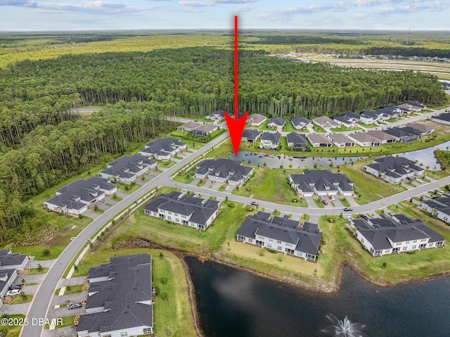 136 Longridge Ln, Ormond Beach, FL 32174 - aerial view of property and surrounding area featuring a heavily wooded area, a nearby body of water, and nearby suburban area