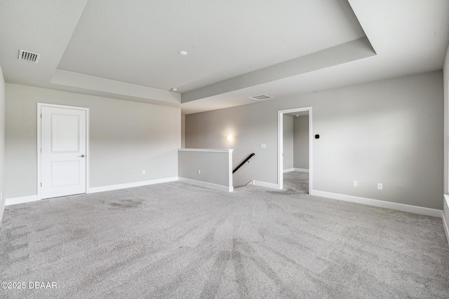 136 Longridge Ln, Ormond Beach, FL 32174 - carpeted empty room featuring a raised ceiling and baseboards