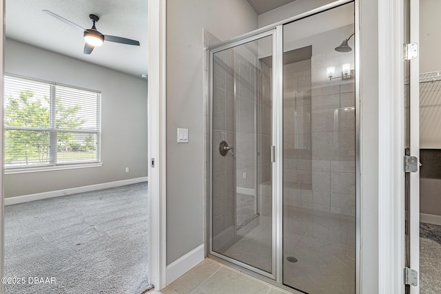 136 Longridge Ln, Ormond Beach, FL 32174 - bathroom featuring a stall shower, a ceiling fan, and baseboards