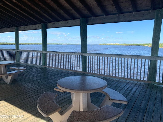 wooden deck featuring a water view