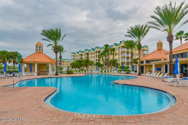 view of swimming pool featuring a patio area