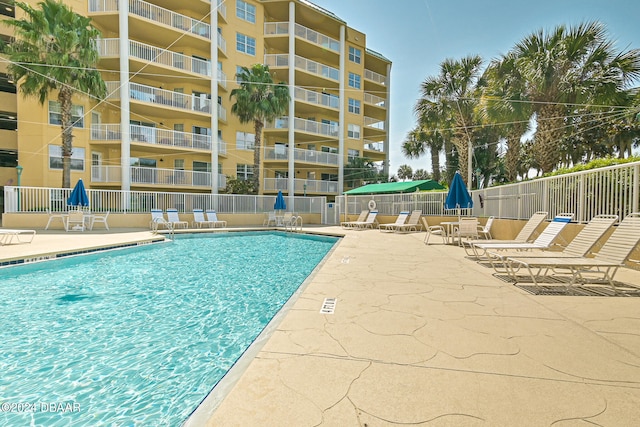 view of pool featuring a patio area