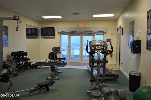 gym featuring a paneled ceiling