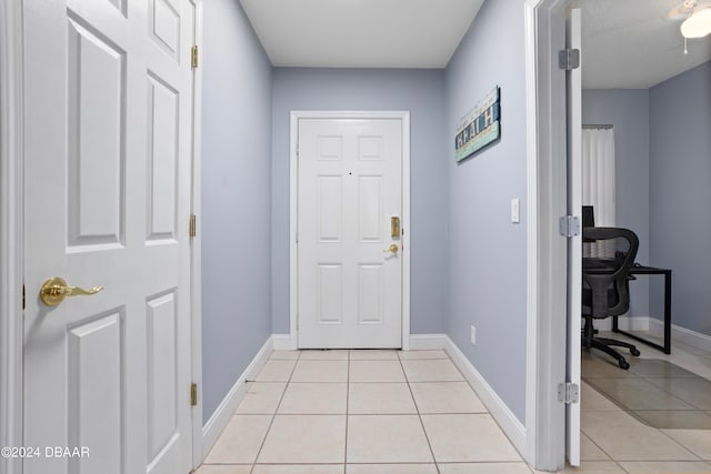 entryway featuring light tile patterned flooring