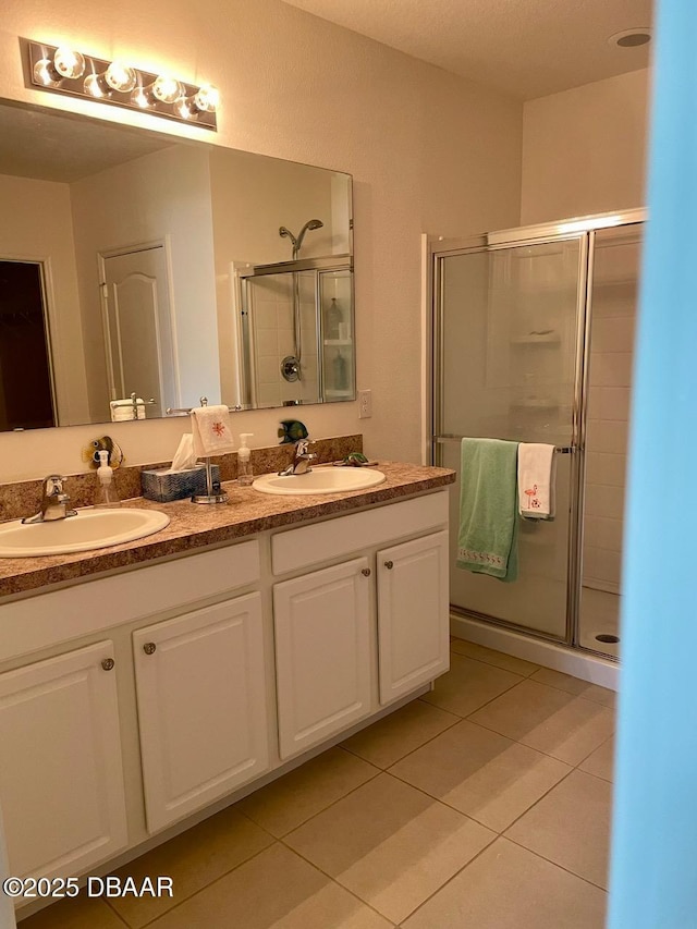 119 Fishermans Cove Dr, Edgewater, FL 32141 - bathroom with a stall shower, tile patterned flooring, and double vanity