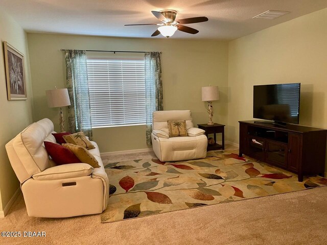 119 Fishermans Cove Dr, Edgewater, FL 32141 - living area featuring carpet floors, a ceiling fan, and baseboards