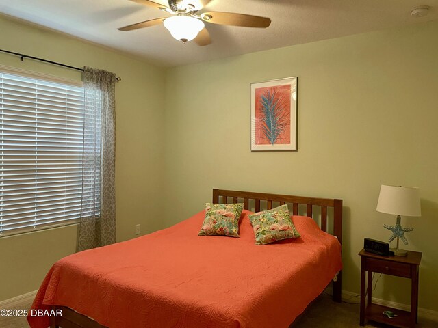 119 Fishermans Cove Dr, Edgewater, FL 32141 - carpeted bedroom with baseboards and a ceiling fan