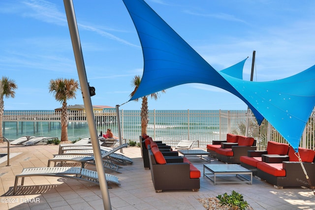 view of patio / terrace with outdoor lounge area and a water view