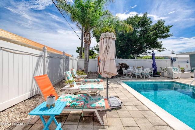 view of swimming pool featuring a patio