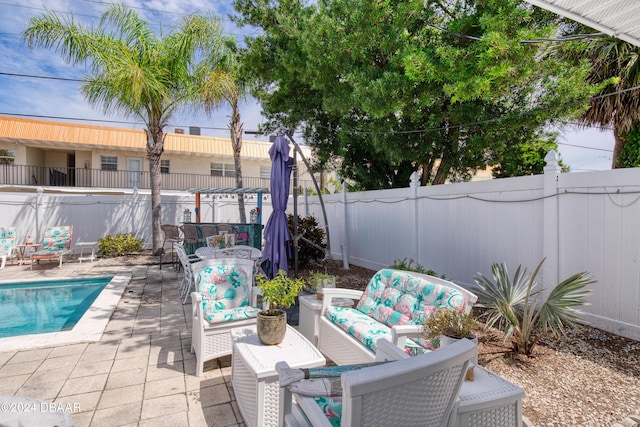 view of patio / terrace featuring a fenced in pool