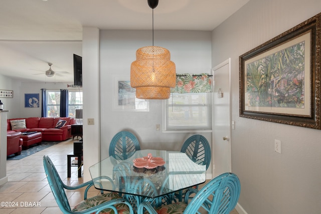 dining area featuring ceiling fan and light tile patterned floors