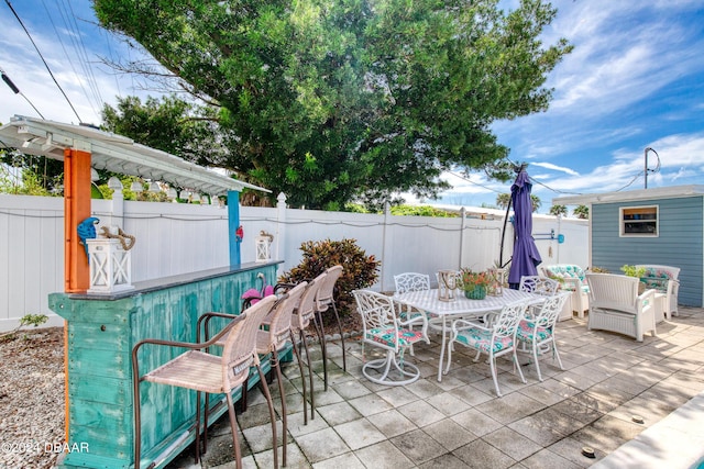 view of patio / terrace with an outdoor bar