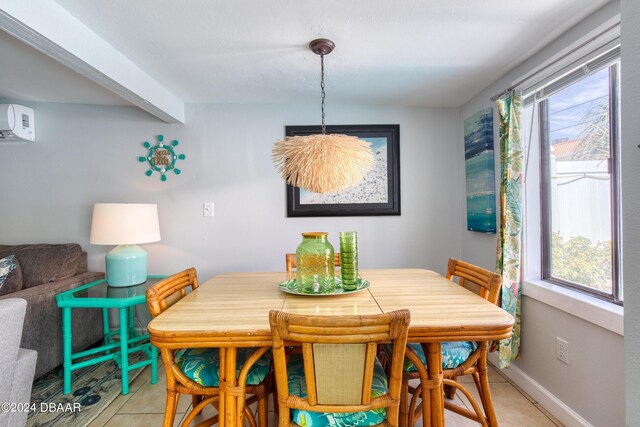 dining area featuring light tile patterned floors and a wall unit AC