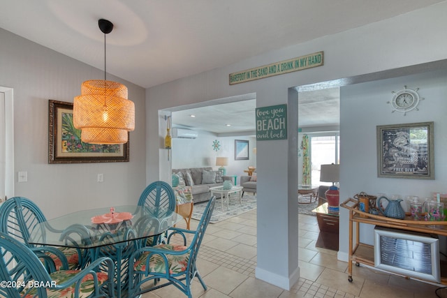 dining space featuring a wall mounted AC, light tile patterned floors, and lofted ceiling