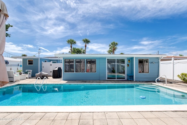 view of swimming pool with a patio area