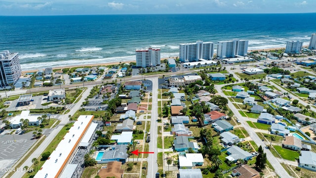 bird's eye view featuring a water view and a view of the beach