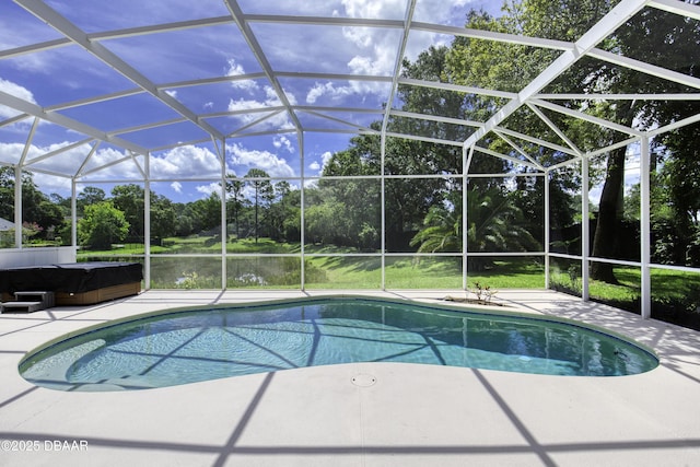 3 Indian Springs Dr, Ormond Beach, FL 32174 - outdoor pool with a hot tub, view of scattered trees, a patio area, and a lanai