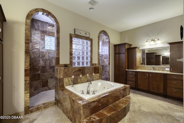 3 Indian Springs Dr, Ormond Beach, FL 32174 - bathroom with a whirlpool tub, vanity, and walk in shower