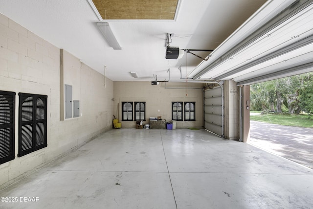 3 Indian Springs Dr, Ormond Beach, FL 32174 - garage with a garage door opener, electric panel, and concrete block wall