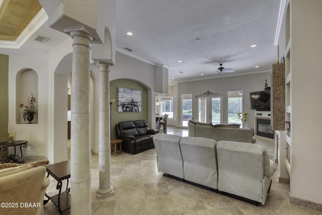 3 Indian Springs Dr, Ormond Beach, FL 32174 - living area featuring ornate columns, crown molding, a ceiling fan, recessed lighting, and arched walkways