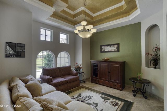 3 Indian Springs Dr, Ormond Beach, FL 32174 - living area featuring crown molding, a chandelier, and coffered ceiling