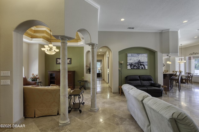3 Indian Springs Dr, Ormond Beach, FL 32174 - living room with crown molding, ornate columns, recessed lighting, a chandelier, and arched walkways