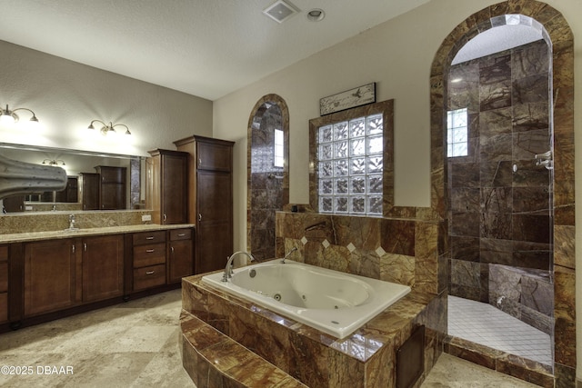 3 Indian Springs Dr, Ormond Beach, FL 32174 - bathroom featuring a whirlpool tub, vanity, and a walk in shower