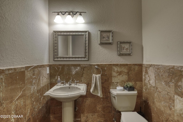 3 Indian Springs Dr, Ormond Beach, FL 32174 - half bathroom with tile walls and wainscoting
