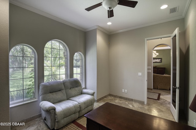 3 Indian Springs Dr, Ormond Beach, FL 32174 - living area with ceiling fan, arched walkways, and crown molding