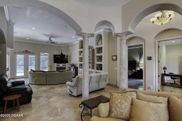 3 Indian Springs Dr, Ormond Beach, FL 32174 - living room with ornate columns, built in shelves, ceiling fan, recessed lighting, and arched walkways