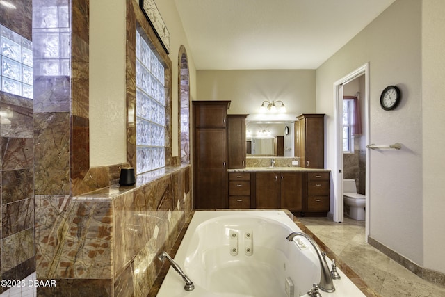 3 Indian Springs Dr, Ormond Beach, FL 32174 - bathroom with a whirlpool tub, plenty of natural light, and vanity