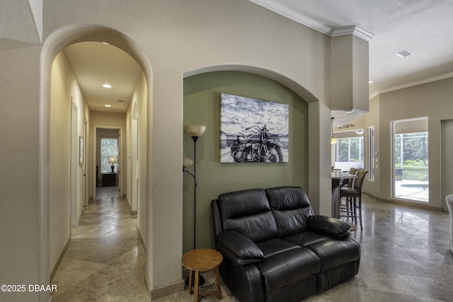3 Indian Springs Dr, Ormond Beach, FL 32174 - corridor featuring crown molding, stone tile flooring, and recessed lighting