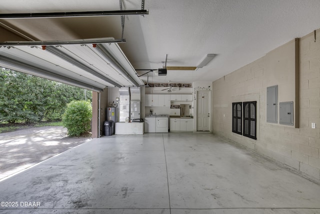 3 Indian Springs Dr, Ormond Beach, FL 32174 - garage with washer and dryer, electric panel, a garage door opener, water heater, and heating unit