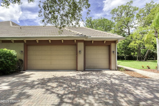 3 Indian Springs Dr, Ormond Beach, FL 32174 - garage featuring decorative driveway