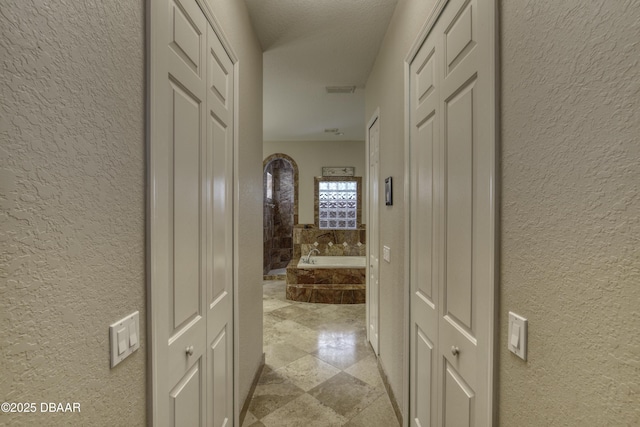 3 Indian Springs Dr, Ormond Beach, FL 32174 - hallway featuring a textured wall