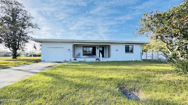 view of front of property featuring concrete driveway, a porch, an attached garage, fence, and a front lawn