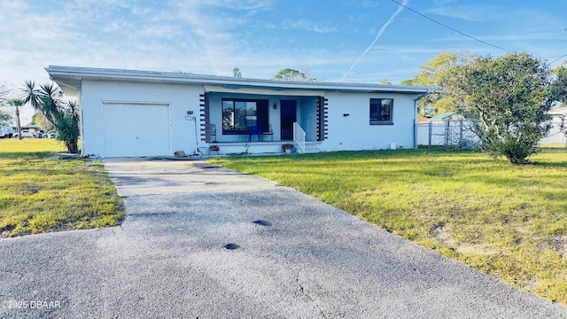 view of front of property with a porch, an attached garage, fence, driveway, and a front lawn