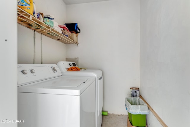 washroom with washer and clothes dryer