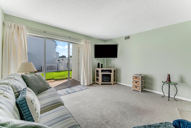 carpeted living room with radiator and a textured ceiling