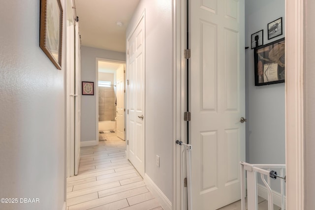 19 Huntington Pl, Ormond Beach, FL 32174 - hall featuring baseboards and light wood finished floors