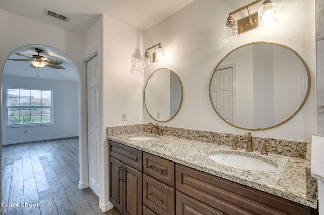 bathroom featuring vanity, hardwood / wood-style flooring, and ceiling fan