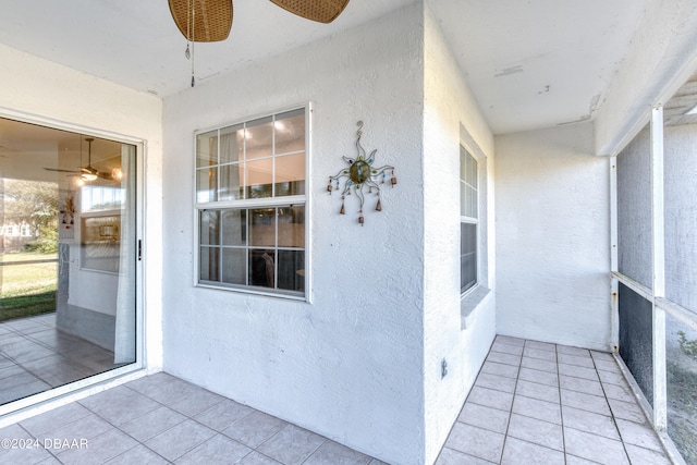 exterior space featuring ceiling fan