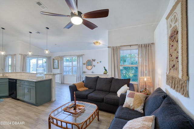 living room with sink, vaulted ceiling, ceiling fan, and light hardwood / wood-style flooring