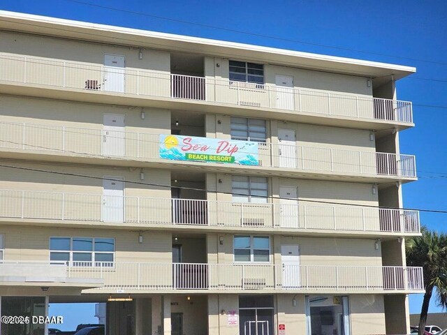 1233 S Atlantic Ave Unit 1040, Daytona Beach, FL 32118 - drone / aerial view featuring a water view and a view of the beach