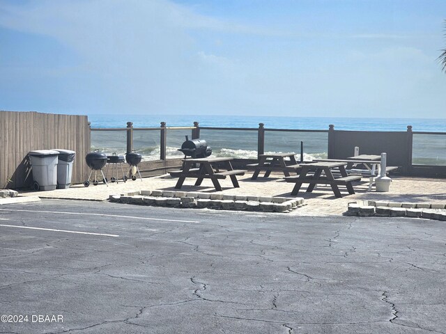 1233 S Atlantic Ave Unit 1040, Daytona Beach, FL 32118 - uncovered parking lot with fence