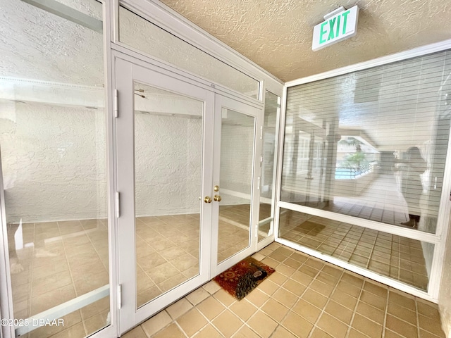 unfurnished sunroom featuring french doors