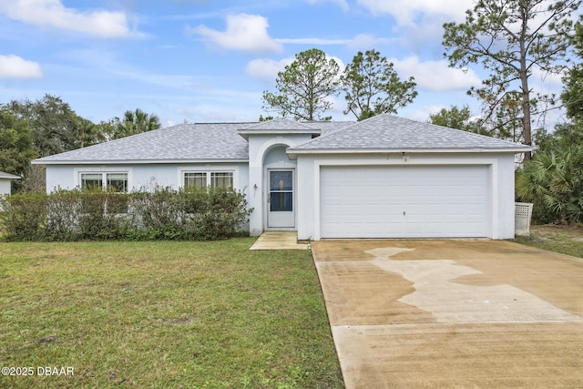 ranch-style home with a garage and a front yard